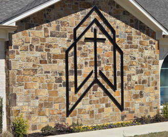 Church Emblem built with 1 1/2” x 3” rectangular tube to match their marketing literature. Powder coated black gloss and set 2” of the stone wall.
