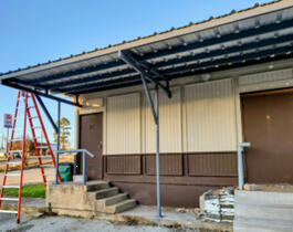 Rear awning for at Happy Trails BBQ restaurant with matching drive thru