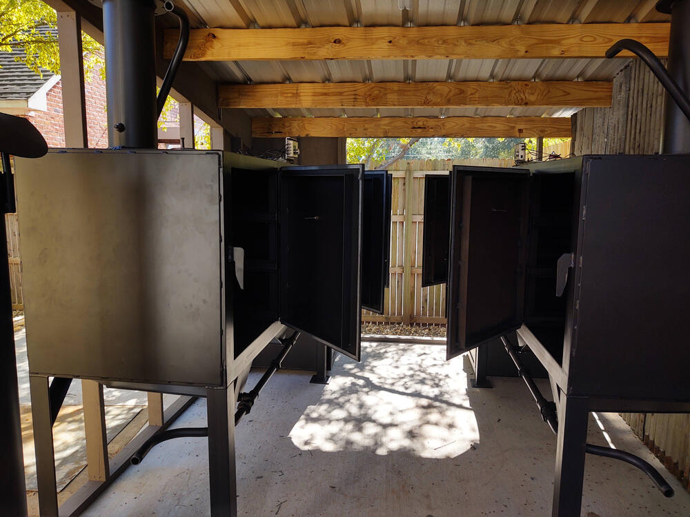 Mirrored restaurant grade smokers, 42 brisket capacity each smoker. Temperature controlled with meat probe alarms