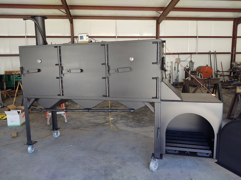 Mirrored restaurant grade smokers, 42 brisket capacity each smoker. Temperature controlled with meat probe alarms